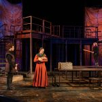 Will Block, Charlotte Boyce Munson and Aria Atkinson standing mid-stage