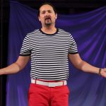 Jono Eiland in a striped shirt and bright red pants