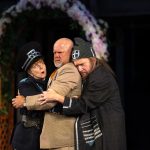 Patty Gallagher, Mike Ryan and Dan Donohue hugging eachother